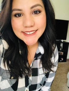 woman in plaid shirt smiling photo